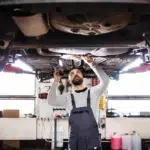 An expert technician performing routine engine service and checks for optimal performance