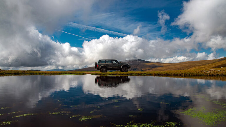 Range Rover off-road near lake showcasing range rover engine power